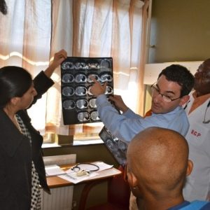 group of four diverse medical students examining an x-ray