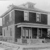 Multistory house with fence on street corner