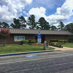 Single-story brick building and parking lot