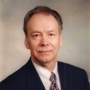 White man in suit and tie