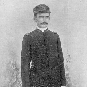 White man with mustache in military uniform with cap