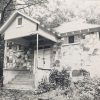 Single-story building with stone walls and covered porch steps