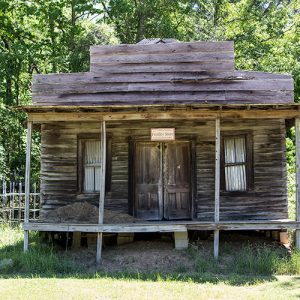 Single-story storefront building with covered porch