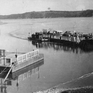 Ferry pulling into dock at lake's edge