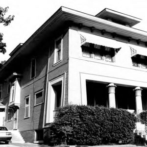 Multistory house with two front columns and stairs