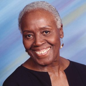 Older African-American woman smiling in dress