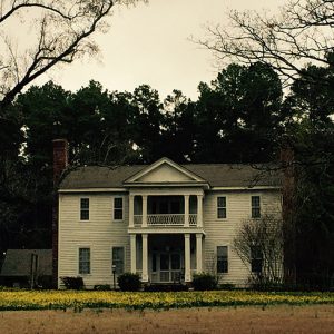 Two-story house with covered porch and balcony