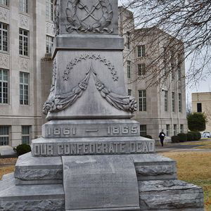 Close-up of monument pedestal with star and crossed swords engravings dedicated to "our Confederate dead"