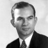 White man in suit with decorative tie