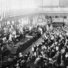 Crowded convention hall with speakers on stage