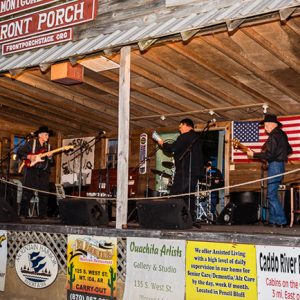 musicians performing on storefront stage