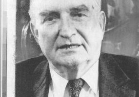 Old white man in suit and tie