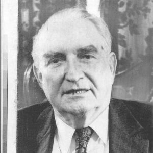 Old white man in suit and tie