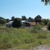 Mill buildings in overgrown field