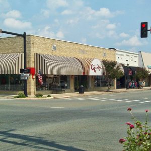 Single-story brick storefront buildings on town street