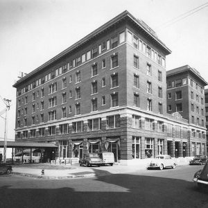 Multistory building with covered entrance and parking lot