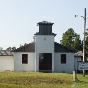 Single-story building with steeple and "Good Hope A.M.E. Church" sign in the foreground