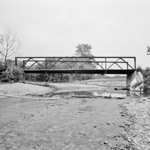 Steel truss bridge over mostly dried up creek