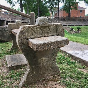 Stone bench and concrete stands in outdoor auditorium