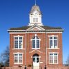 two story brick building with clock tower