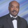 African-American man with mustache in suit and bow tie