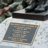 Memorial "Operation Iraqi Freedom 2" with names bronze boot rifle sculpture and kneeling soldiers behind