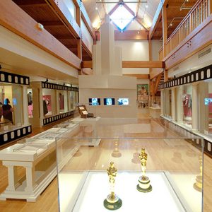 Interior of museum with awards and costumes in display cases