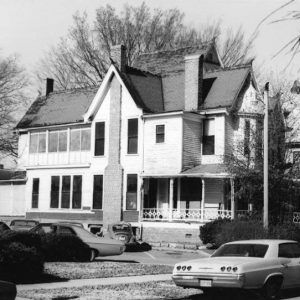 Multistory houses with covered porches on residential street