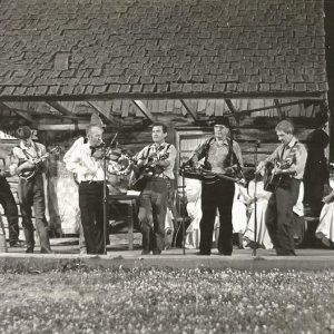 White musicians performing on outdoor stage