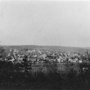 View of town with multistory buildings from elevated overlook