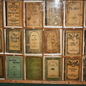 Rows of song books in glass display