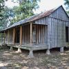 Log cabin with missing door and side window