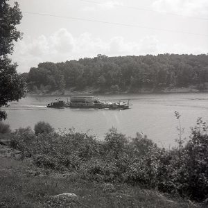 Vehicles on ferry crossing lake