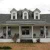 Multistory house with dormer roof and covered porch