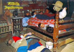 Large white family sleeping in the same bedroom with the words "Hillbilly Togetherness" in the background