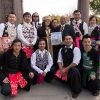 Group of Hmong men and women in traditional garb