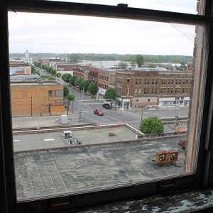 Street with town buildings as seen from hotel window