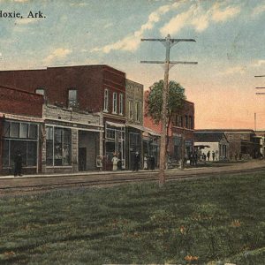 Single and multistory buildings on street with power lines