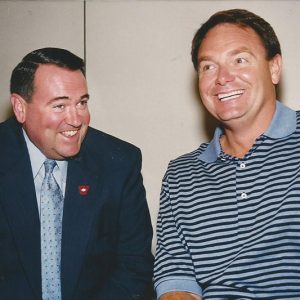 Two white men laughing