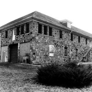 Multistory building with stone walls and double staircase