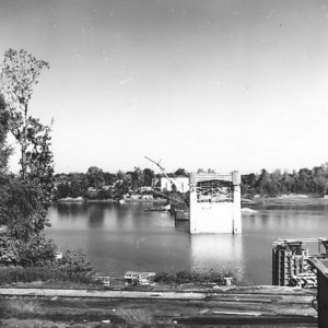 Concrete supporting columns being built in river