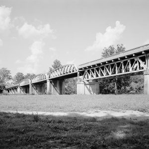 Bridge crossing river as seen from the ground level