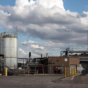 Industrial complex with buildings, tanks, pipes