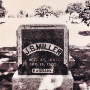 Square "J. B. Miller" gravestone in cemetery