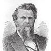 White man with long beard in suit and tie