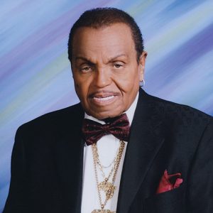 Older African-American man smiling in suit and bow tie