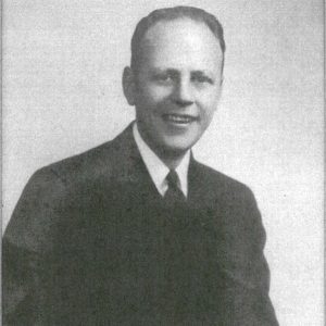 White man smiling in U.S. Navy uniform