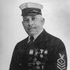 White man with mustache in Naval uniform with medals and cap