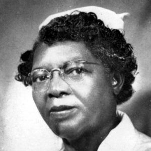 African-American woman with glasses in nursing uniform