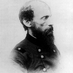 side view of Balding white man with beard in military uniform